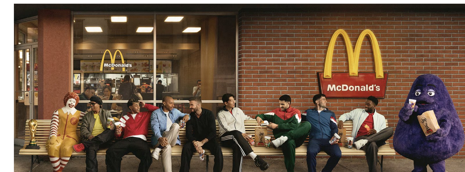 McDonald's FIFA World Cup campaign photo featuring Ronald McDonald, football stars, and Grimace